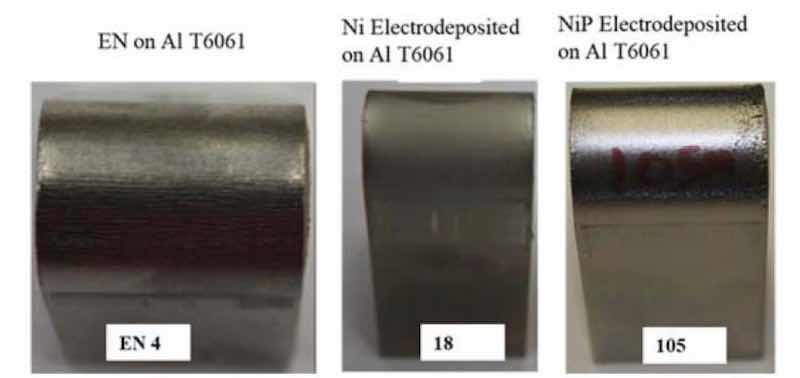 Figure 8 - Left to right: The inflection point of the electroless NiP (EN4), electrolytic Ni (18) and electrolytic NiP (105) coupons after the 0.25” bend radius test.